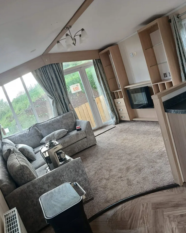 Bright chalet living room after a full clean, with freshly cleaned carpet and spotless surfaces