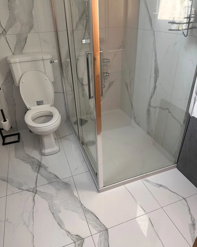 Marble-tiled bathroom cleaned to a spotless finish